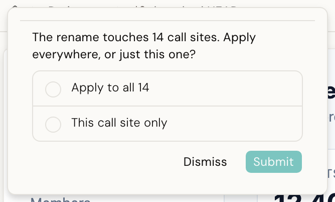 The AI pausing mid-turn to ask a question, with two answer cards and a Submit button